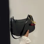 Women's PU Leather Handbag Versatile Fashion Solid Color Cherry Pendant Shoulder Bag Casual Commuting Bag Girl Underarm Bag - Image 2