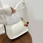 Women's PU Leather Handbag Versatile Fashion Solid Color Cherry Pendant Shoulder Bag Casual Commuting Bag Girl Underarm Bag - Image 4