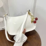 Women's PU Leather Handbag Versatile Fashion Solid Color Cherry Pendant Shoulder Bag Casual Commuting Bag Girl Underarm Bag - Image 5